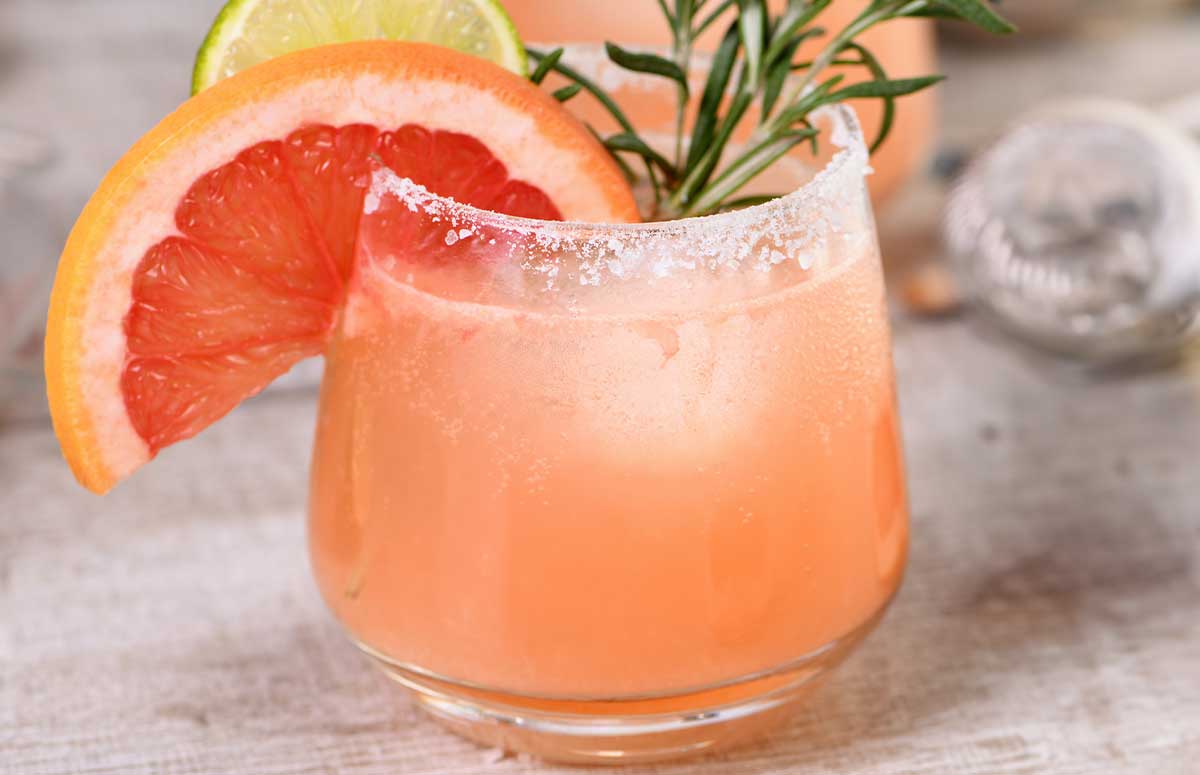 a glass of mezcal paloma
