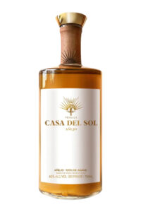 a bottle of casa del sol tequila añejo