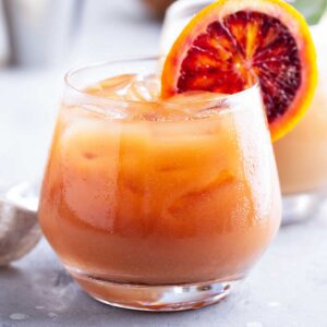 a glass of winter margarita with a blood orange slice in the rim