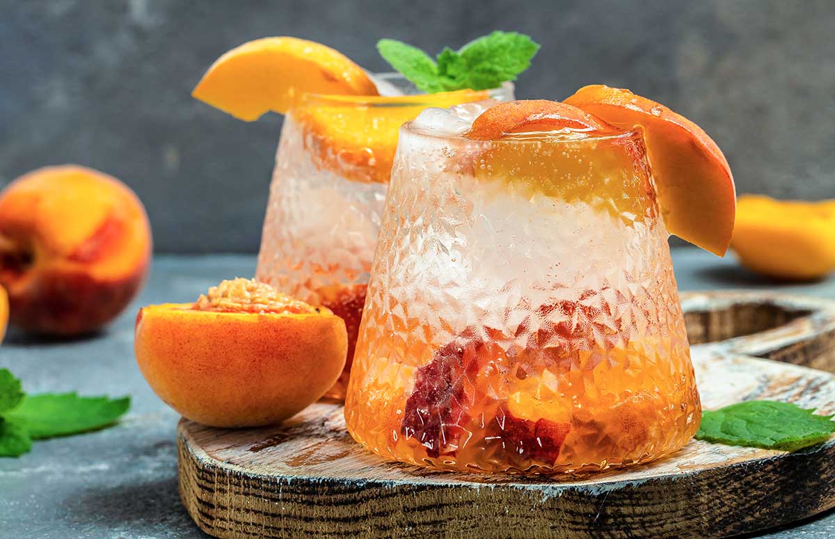 two glasses of peach and raspberry margarita