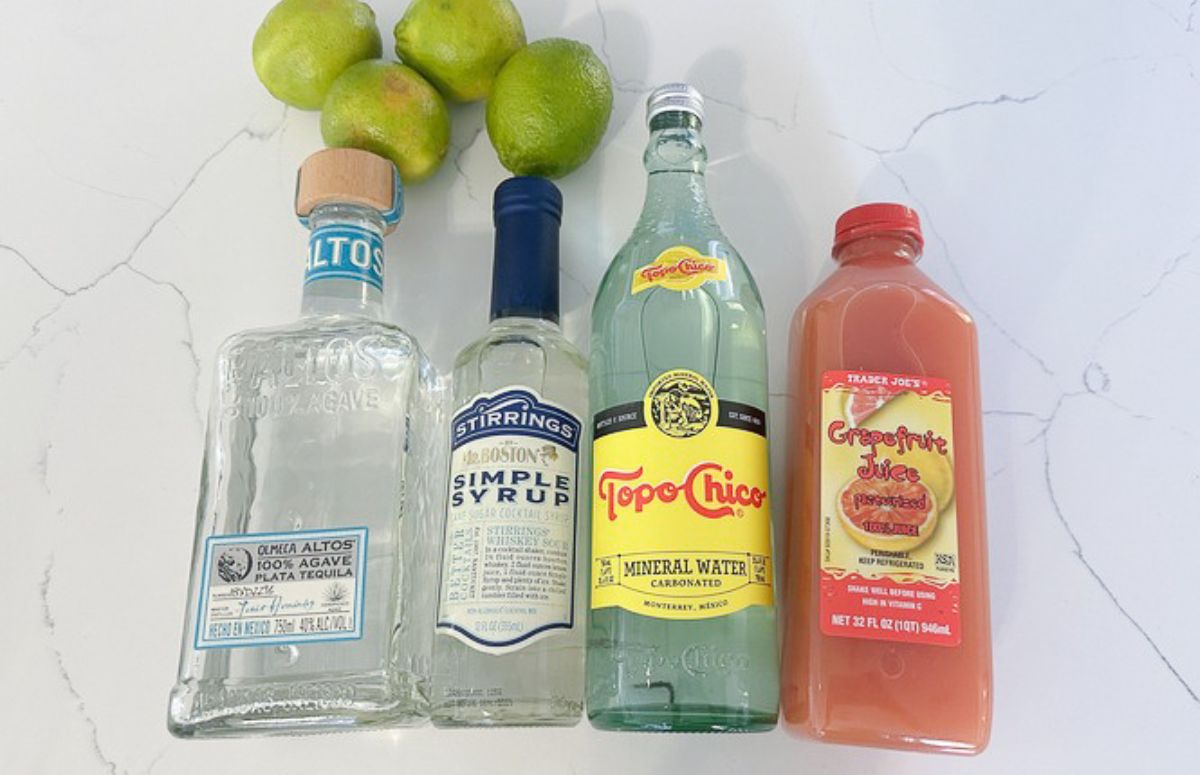Paloma pitcher ingredients, tequila, simple syrup, limes, sparkling water, grapefruit juice