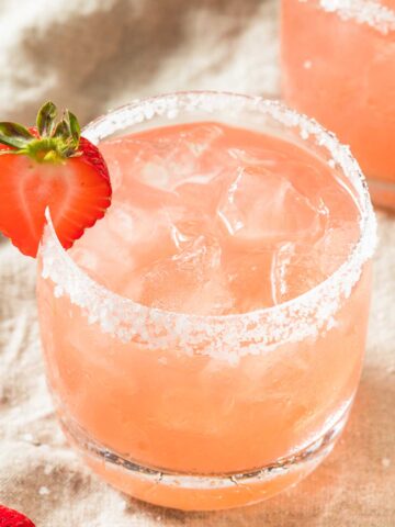 Skinny strawberry margarita with a salted rim and a strawberry garnish