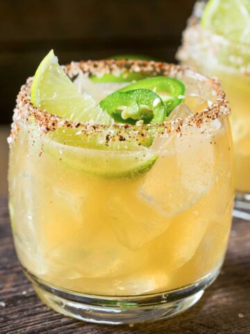 Skinny Spicy Margarita with lime and jalapeno with a salted and Tajin rim