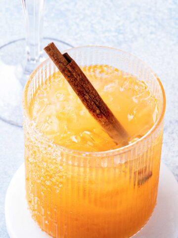 Skinny Pumpkin Margarita with a cinnamon stick and sugared rim