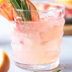 Skinny Paloma cocktail with grapefruit slice and rosemary sprig