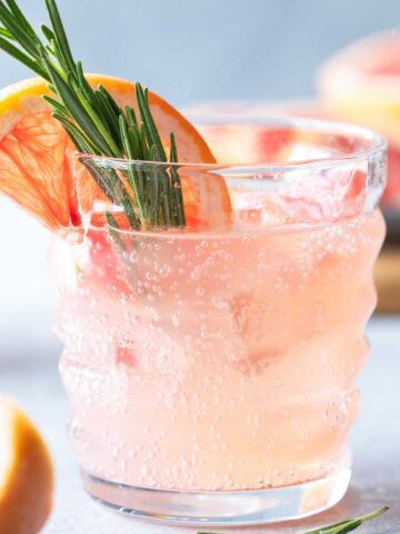 Skinny Paloma cocktail with grapefruit slice and rosemary sprig