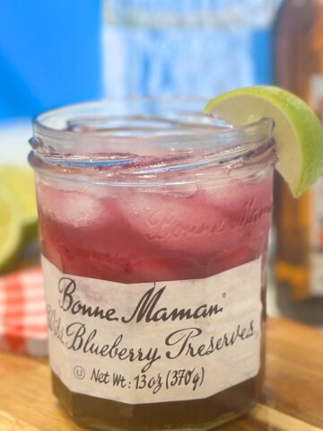 jelly jar Margarita with a lime wedge