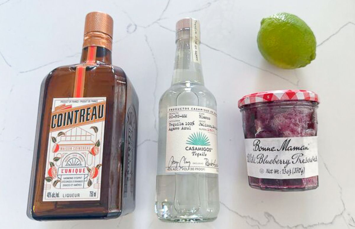 jelly jar Margarita ingredients, Cointreau, tequila, jam jar, and a lime