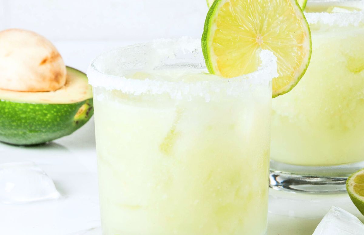 avocado margarita in a glass rimmed with salt