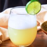 Mezcal Sour with a lime slice