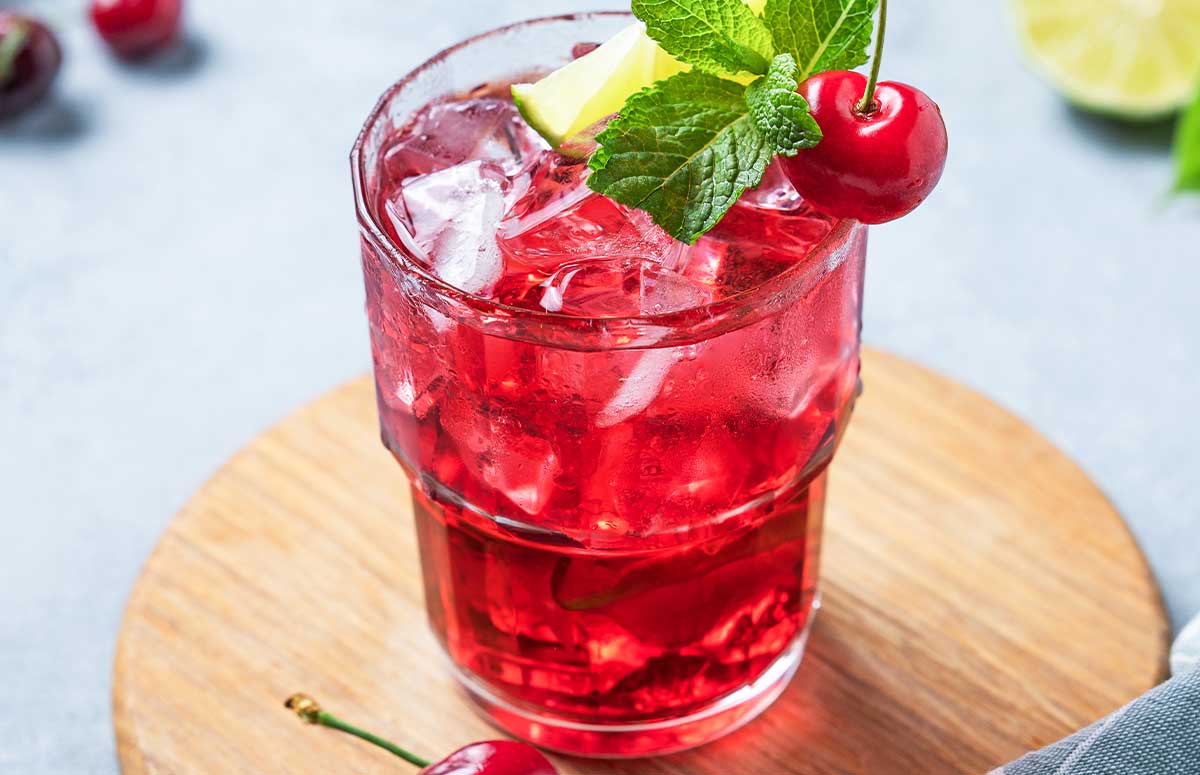 A tequila dirty shirley cocktail in a glass