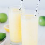 two tall glasses of boozy frozen lemonade