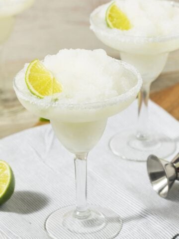 two frozen lime margaritas in glasses