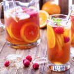 Pitcher of iced tea and tequila and two tall tea glasses