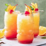 three tall glasses of fruity tequila punch