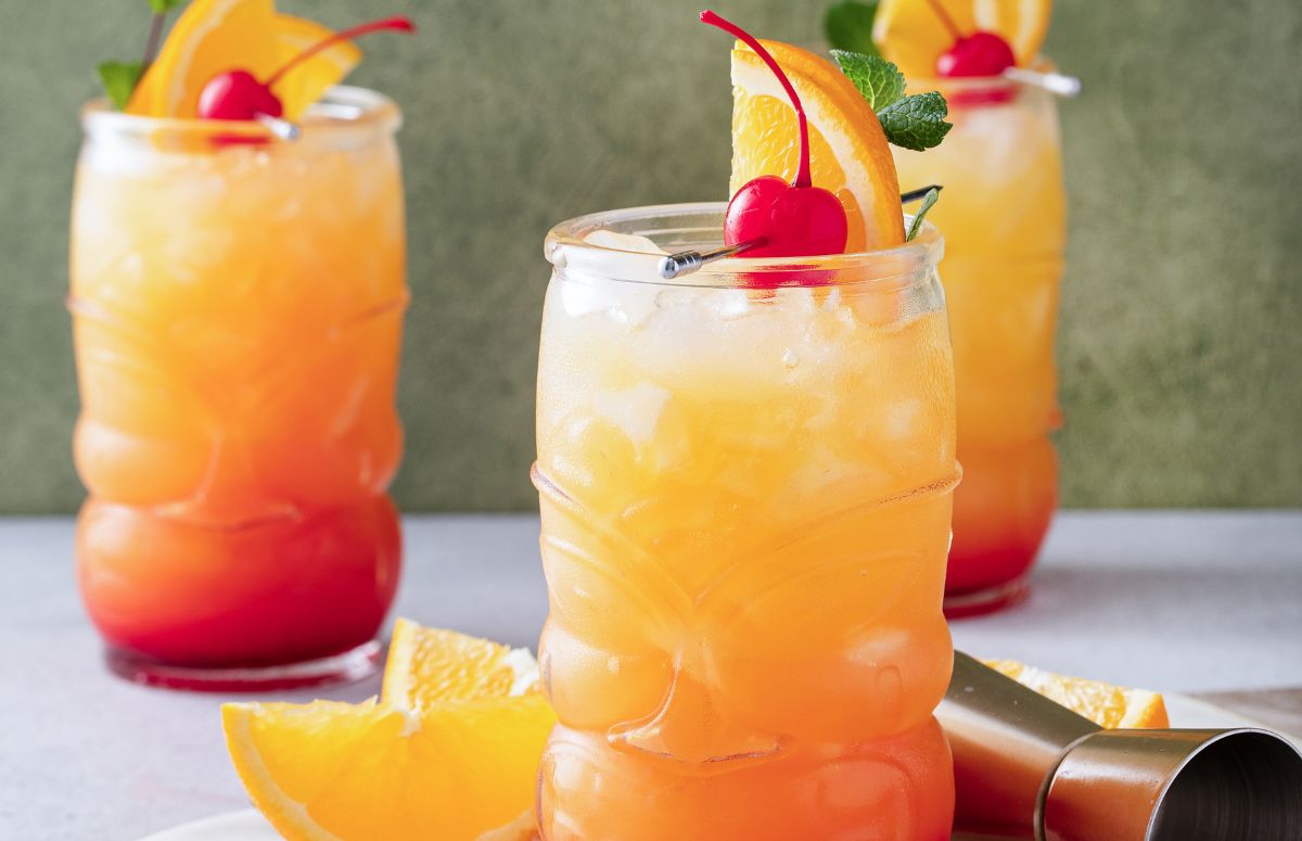three tall glasses of a fruity tequila punch