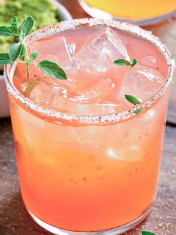 a glass of papaya margarita