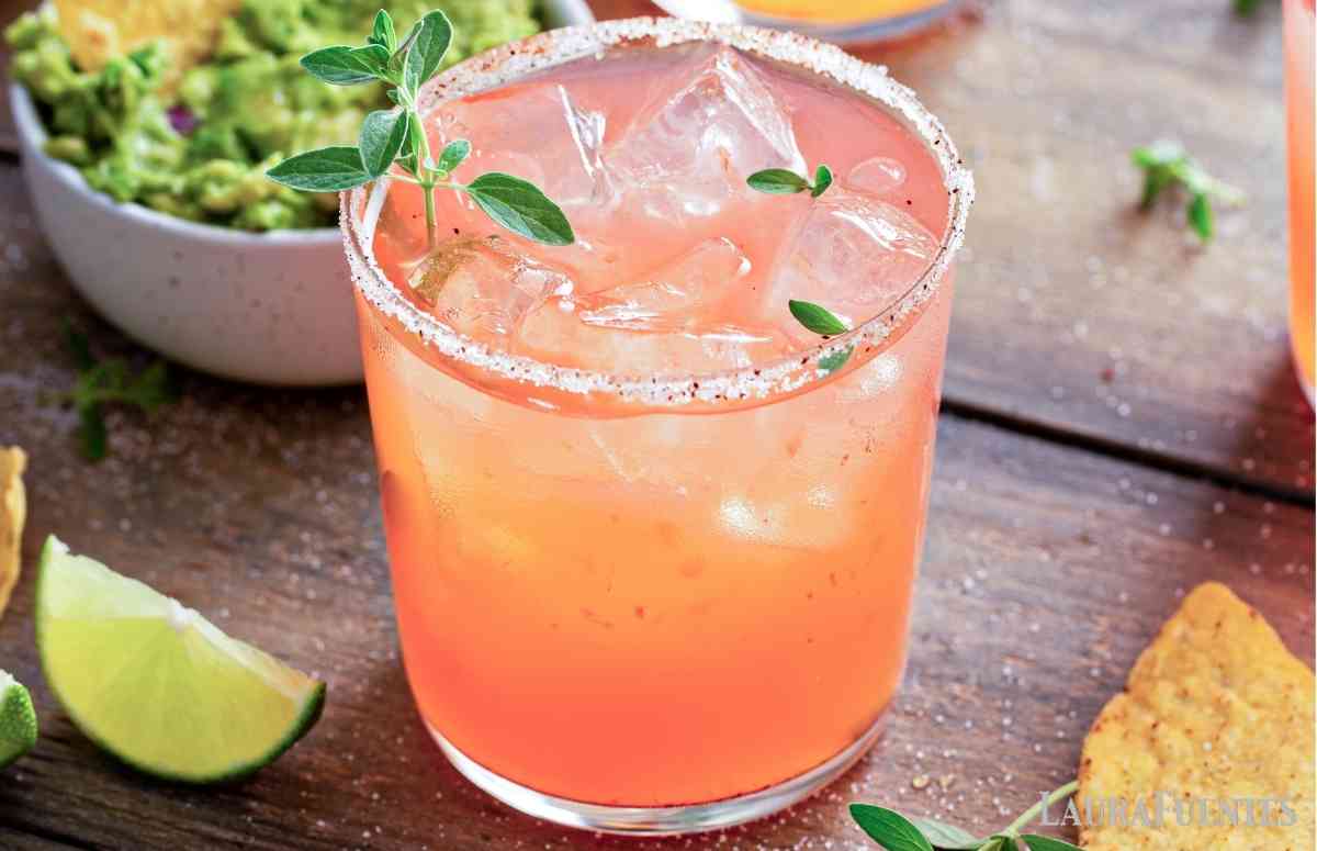 a glass of papaya margarita